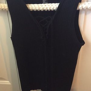 Black tank top. Laced down in front